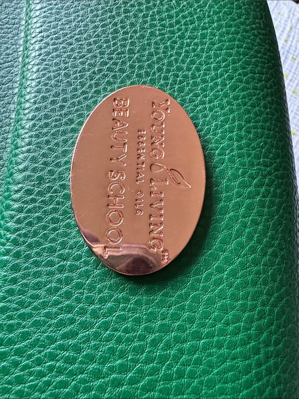 Young Living Green Case with Rose Gold Oval Emblem